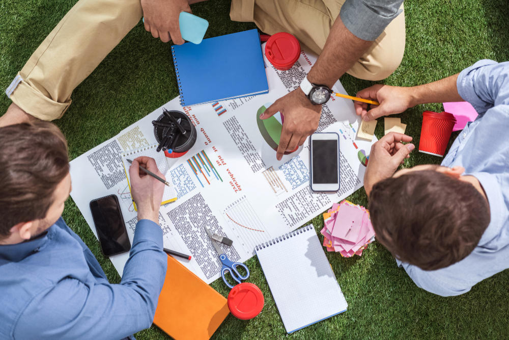 overhead-view-business-people-working-new-business-plan-business-teamwork